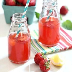 Fresh Strawberry Lemonade shown in two glasses with straws.