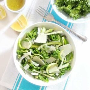shaved asparagus salad with dressing and a small bowl of lettuce