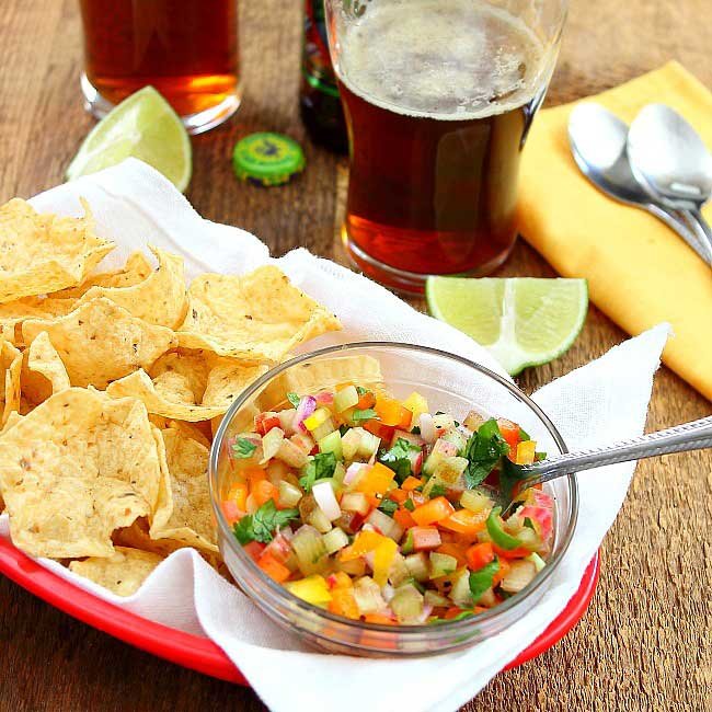 rhubarb salsa in a red basket with chips