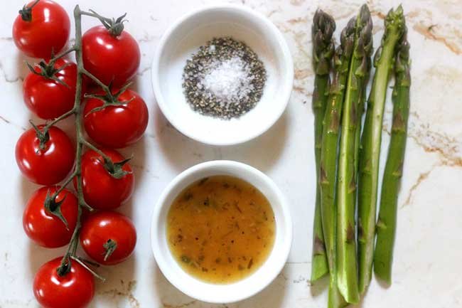 row of tomatoes, asparagus salt and pepper & olive oil