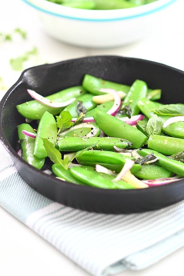 Easy sauteed sugar snap peas in a frying pan